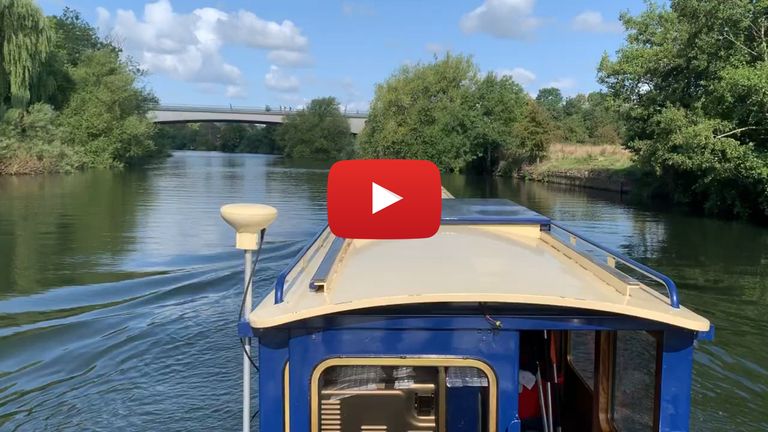 narrowboat towing kayak on The Thames